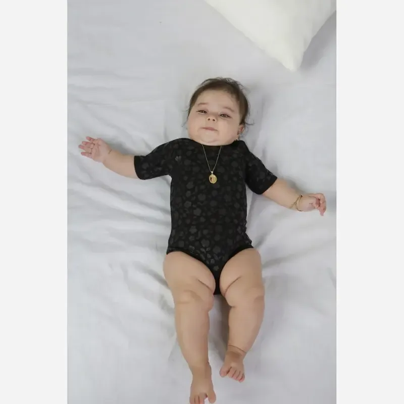 بادی نوزادی زیر دکمه دار مشکی تمام نخ پنبه طرح دار